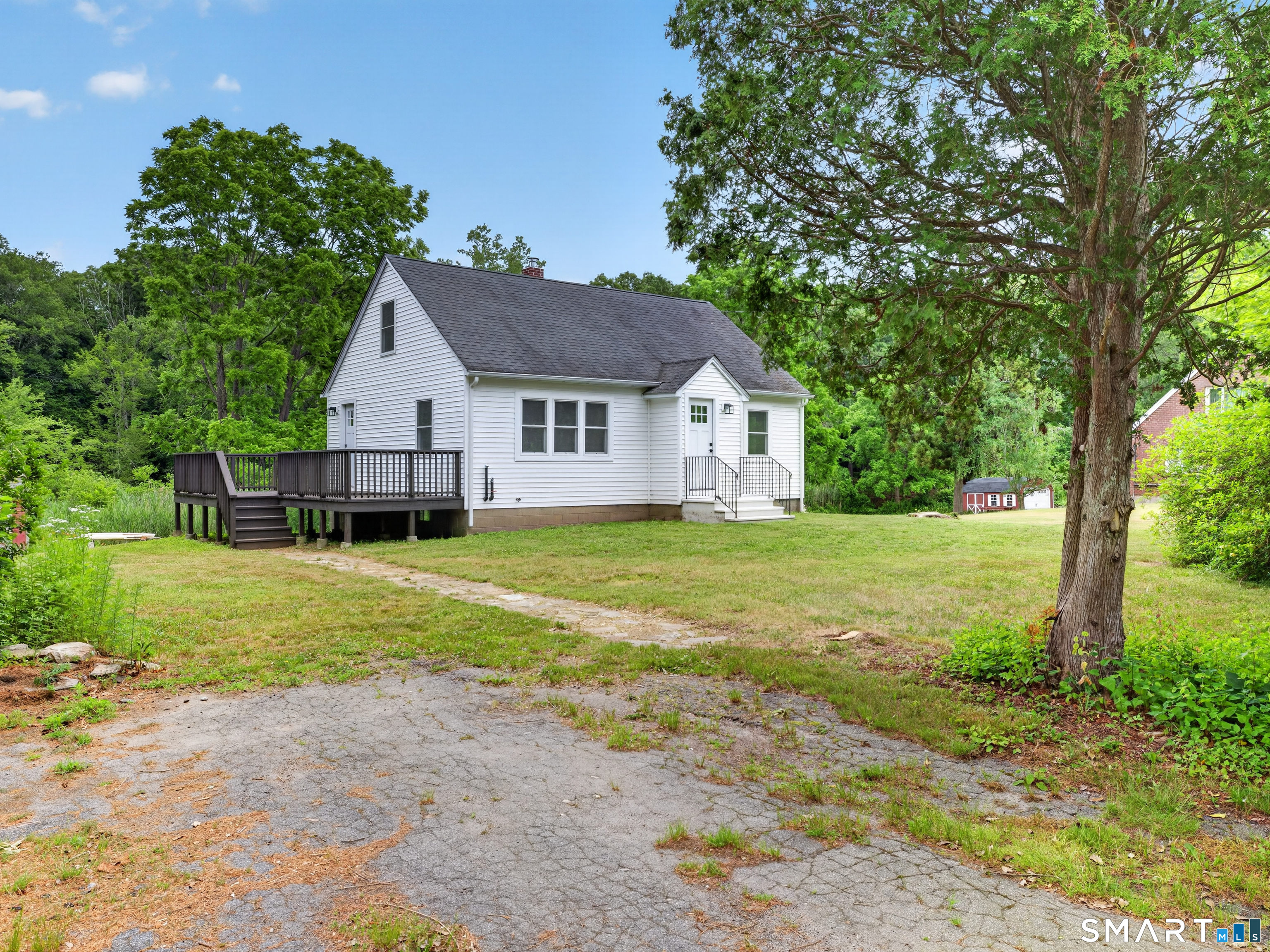 1039 N Road Groton, CT 06340 - Photo 3 of 26 a view of a house with backyard and garden