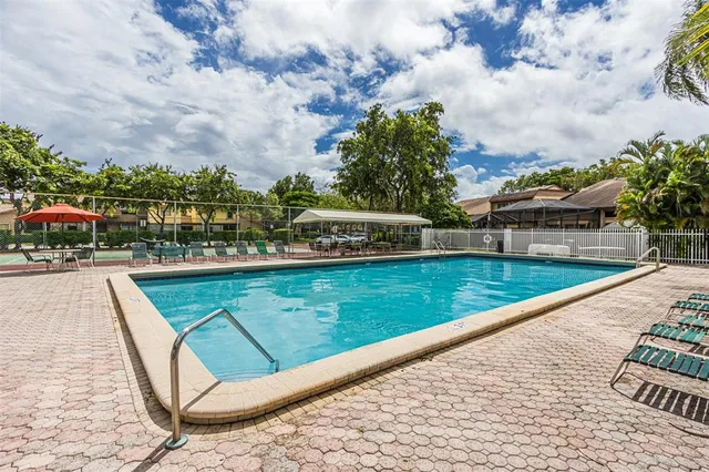 a view of a playground with basketball court
