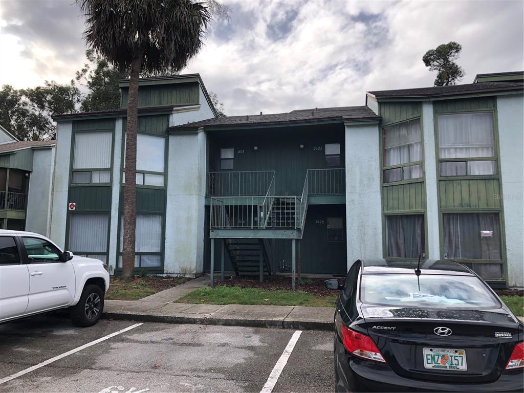 2616 Lemon Tree Lane, Unit F Orlando, FL 32839 - Photo 1 of 11 a car parked in front of a house