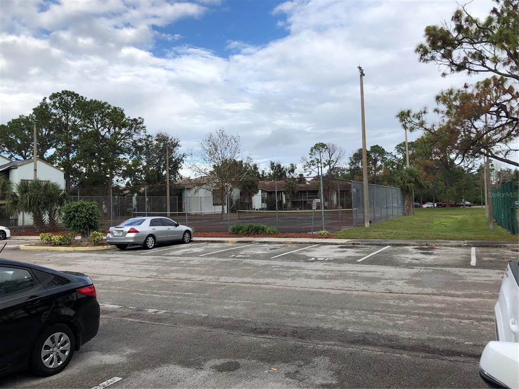 2616 Lemon Tree Lane, Unit F Orlando, FL 32839 - Photo 2 of 11 a view of street with parked cars