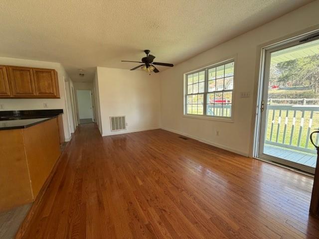 425 Chubbtown Road Cedartown, GA 30125 - Photo 11 of 29 a view of an empty room with a window and wooden floor
