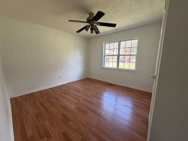 425 Chubbtown Road Cedartown, GA 30125 - Photo 20 of 29 a view of empty room with wooden floor and fan