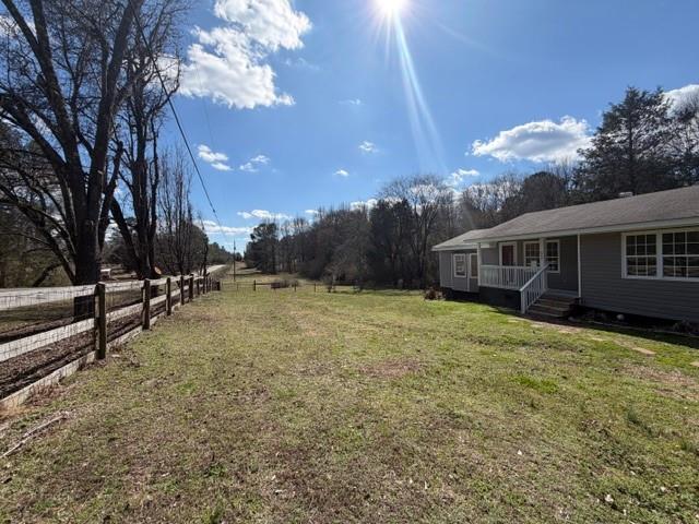 425 Chubbtown Road Cedartown, GA 30125 - Photo 2 of 29 a view of a house with backyard and trees