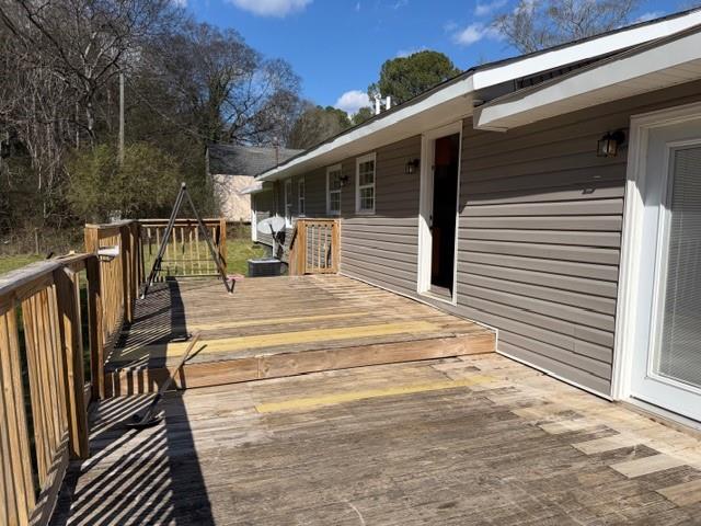 425 Chubbtown Road Cedartown, GA 30125 - Photo 6 of 29 a view of balcony with wooden floor and fence