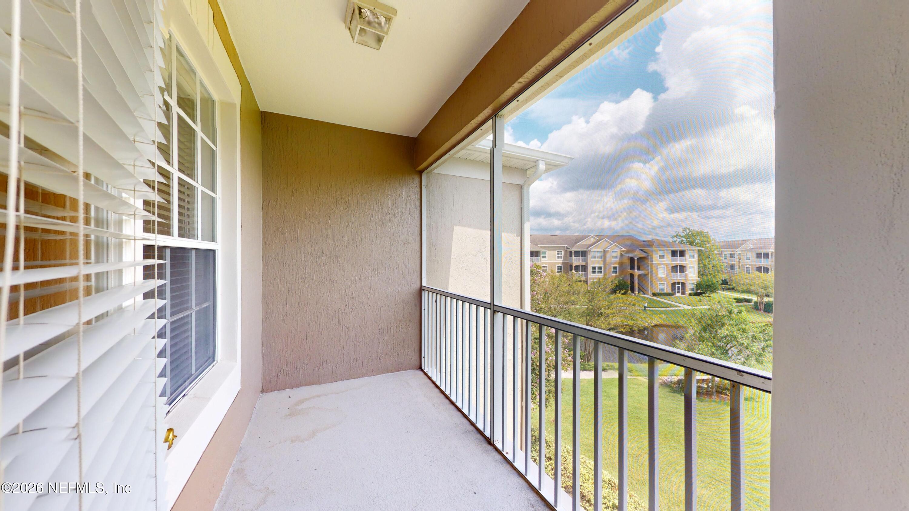 7990 Baymeadows Road East, Unit 912 Jacksonville, FL 32256 - Photo 14 of 25 a view of a balcony with city view