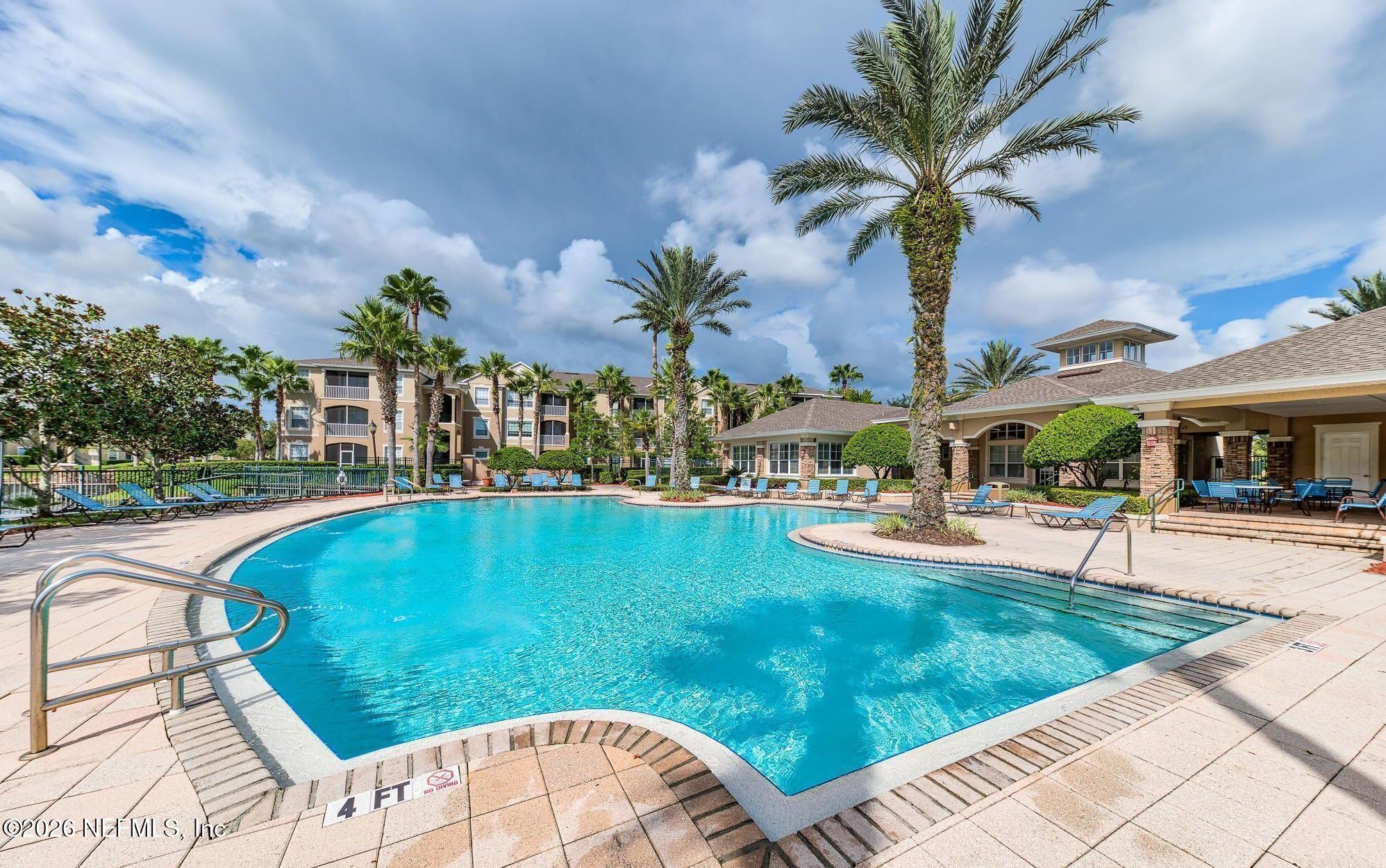 7990 Baymeadows Road East, Unit 912 Jacksonville, FL 32256 - Photo 21 of 25 a view of swimming pool with outdoor seating