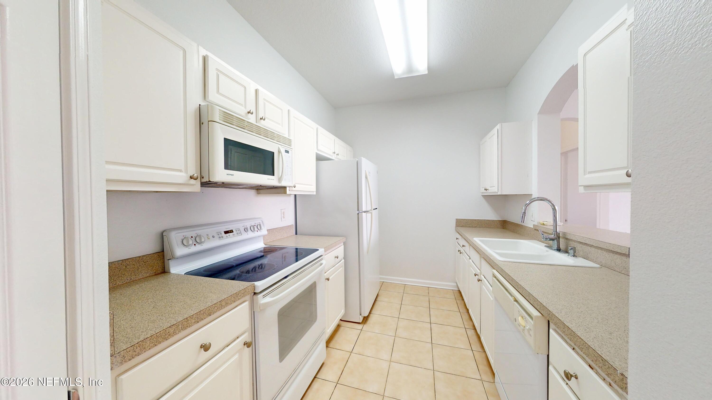 7990 Baymeadows Road East, Unit 912 Jacksonville, FL 32256 - Photo 5 of 25 a room with storage and utility