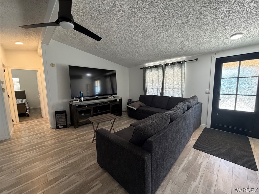 1910 Rio Grande Road Bullhead City, AZ 86442 - Photo 8 of 29 Living space featuring wood-finish flooring, a contemporary ceiling fan, and recessed lighting