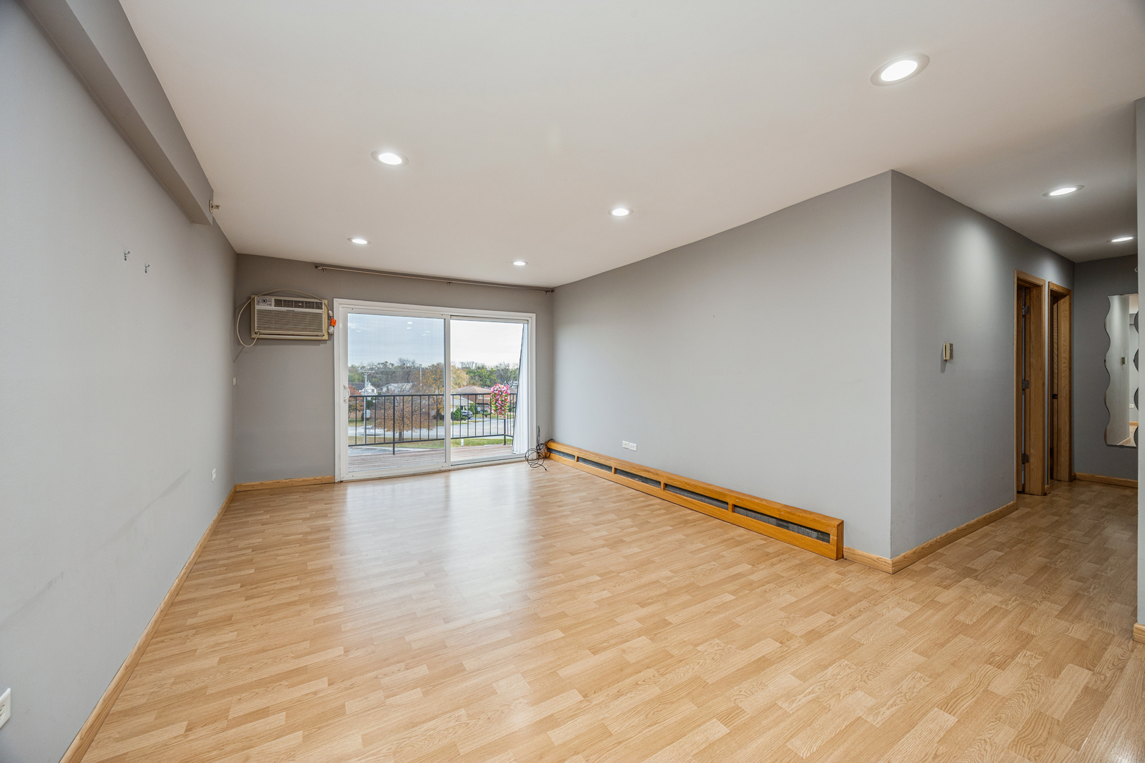 8480 West 103rd Terrace, Unit 301 Palos Hills, IL 60465 - Photo 4 of 17 a view of an empty room with a window
