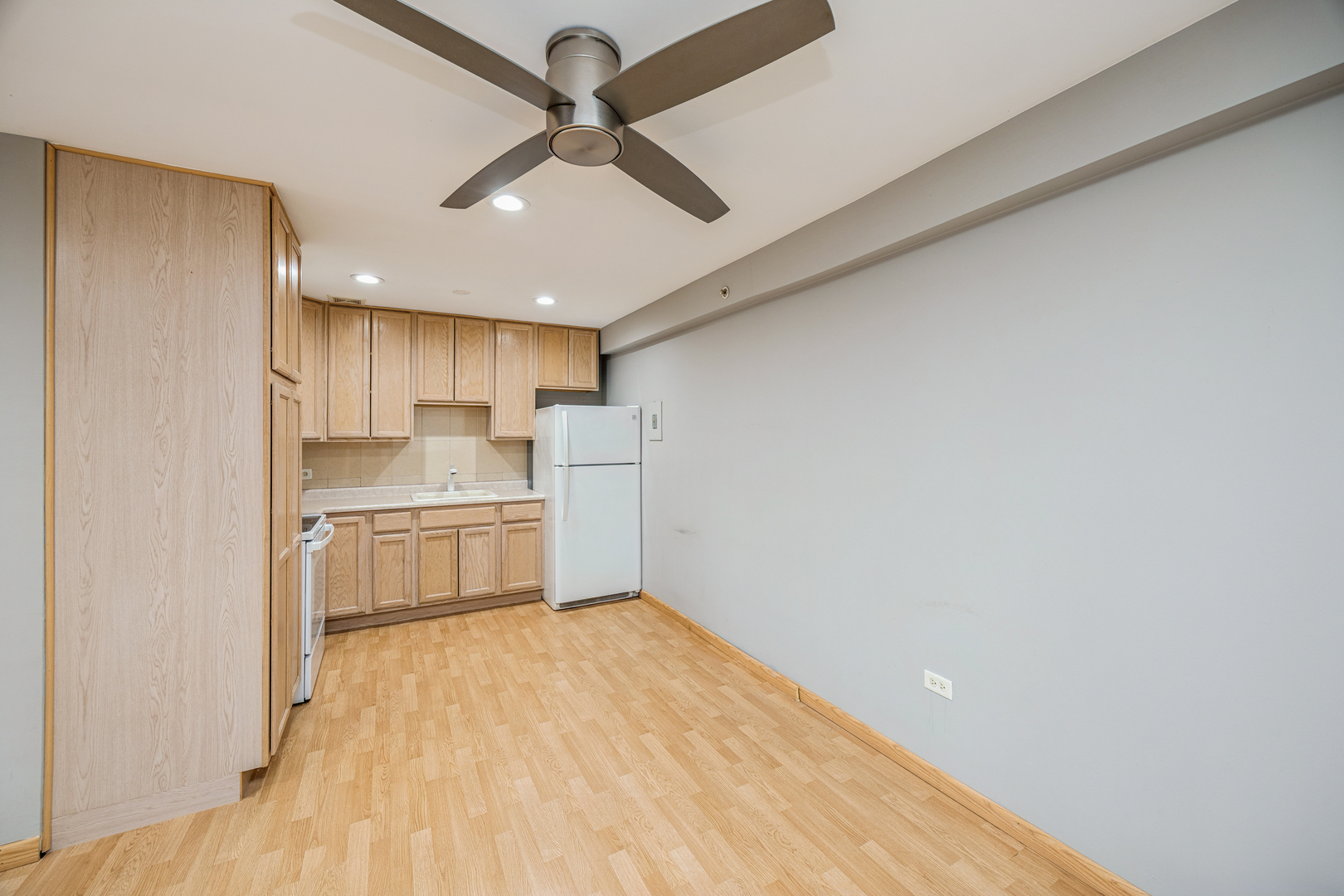 8480 West 103rd Terrace, Unit 301 Palos Hills, IL 60465 - Photo 6 of 17 a kitchen with stainless steel appliances a refrigerator and a stove top oven