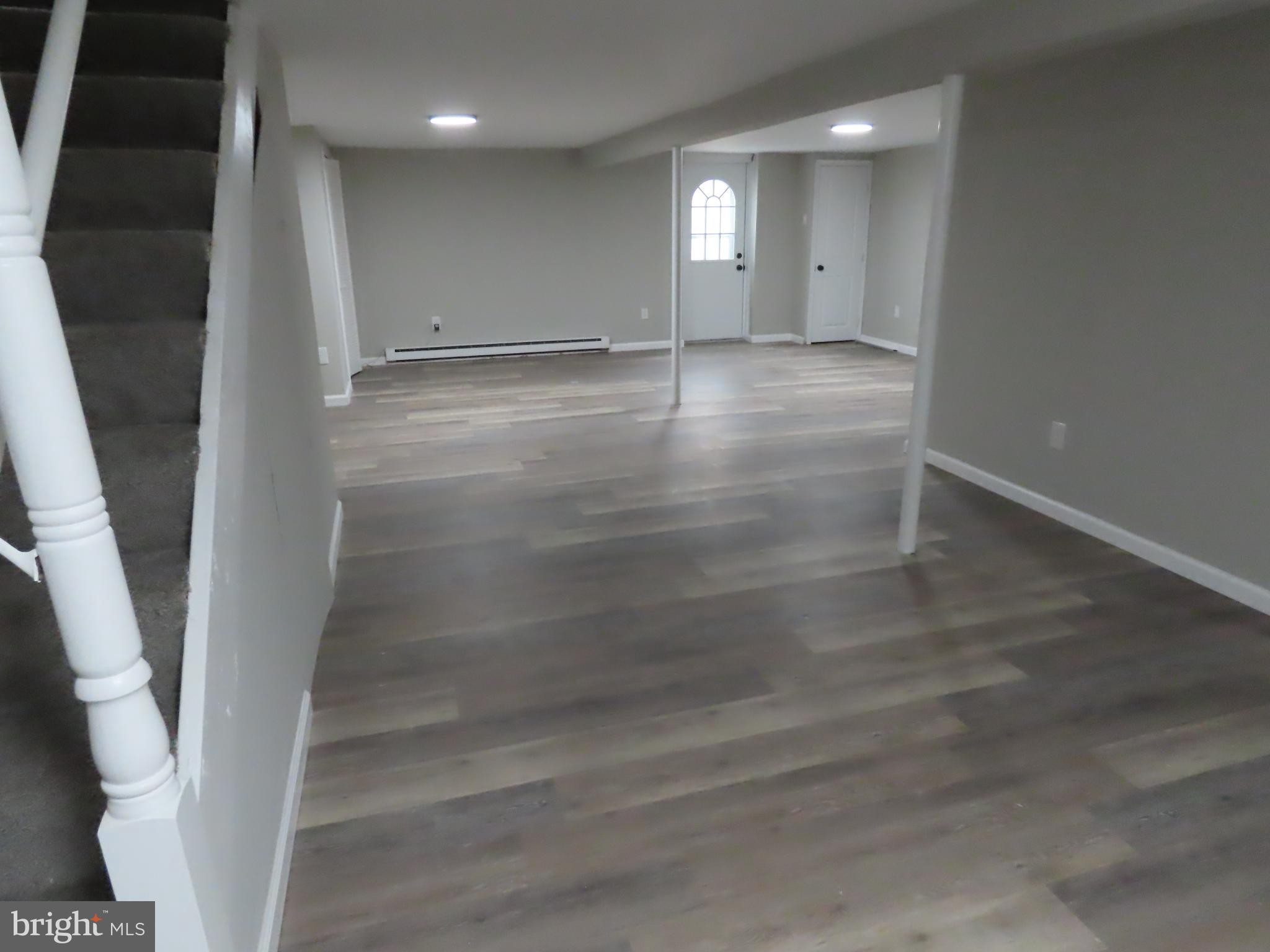 563 Principio Road Port Deposit, MD 21904 - Photo 13 of 16 an empty room with wooden floor and windows