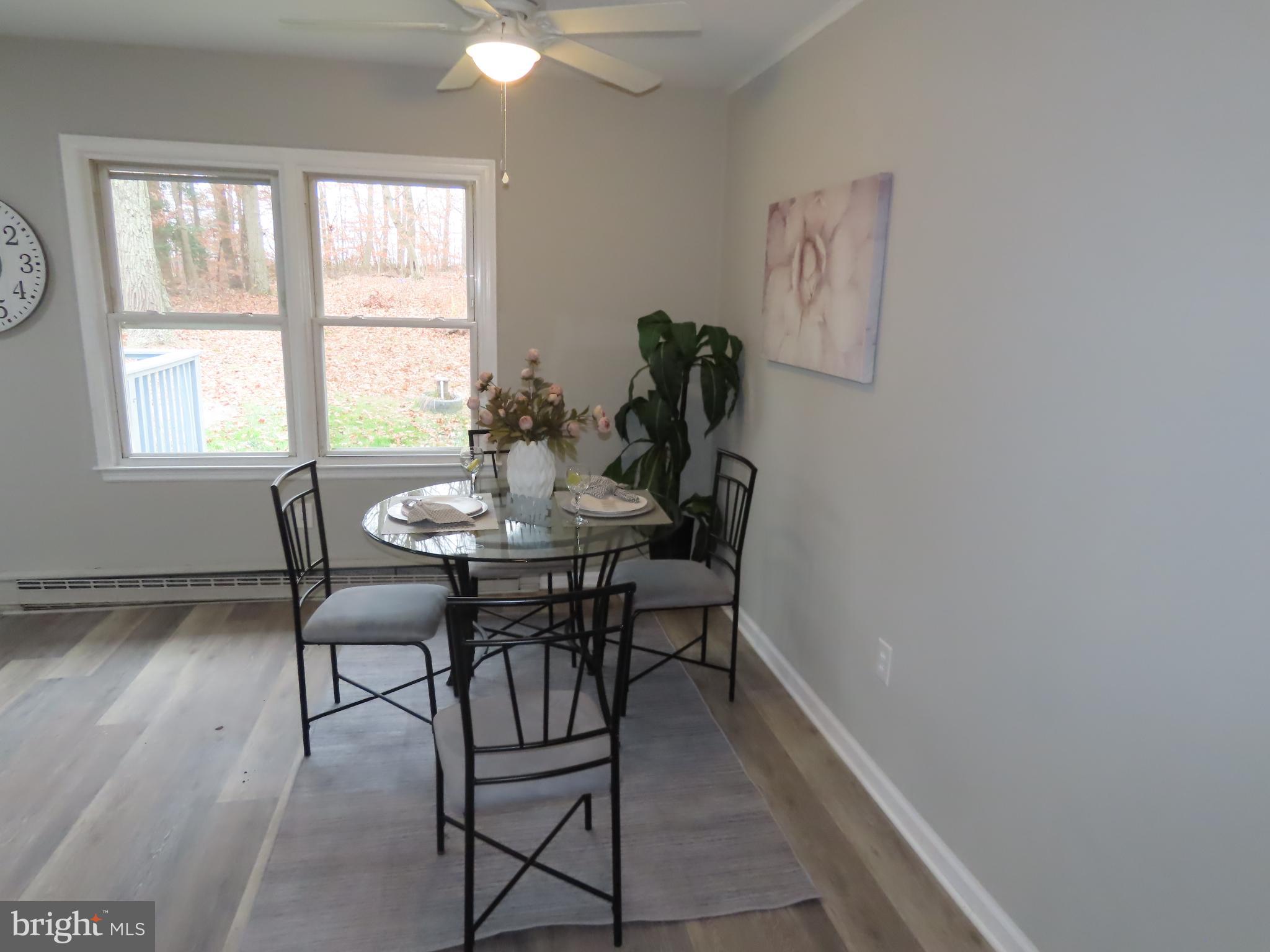 563 Principio Road Port Deposit, MD 21904 - Photo 7 of 16 a view of a dining room with furniture and wooden floor