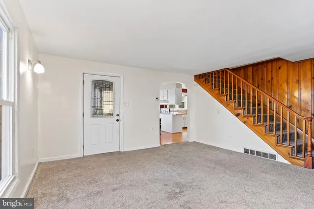 a view of a hallway with staircase