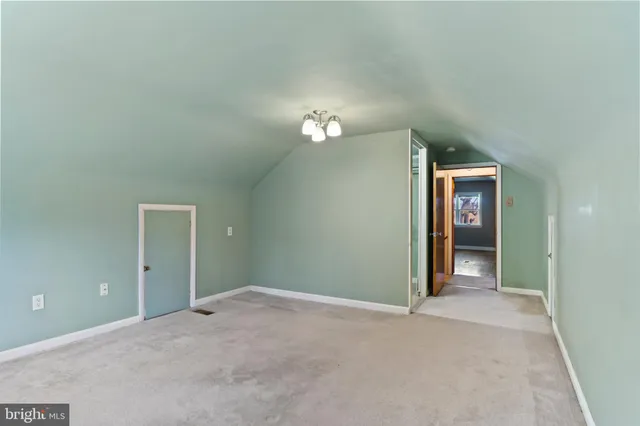 a view of a big room with closet and mirror