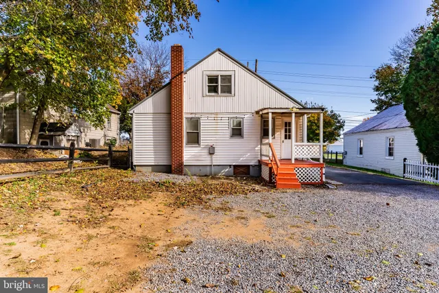 a backyard of a house with barbeque oven