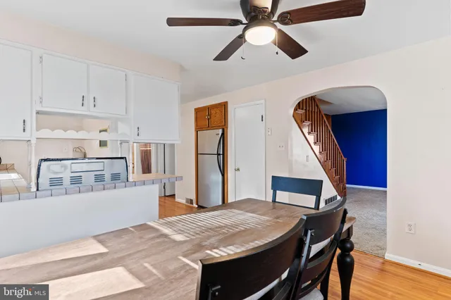 a living room with stainless steel appliances kitchen island granite countertop furniture and a kitchen view