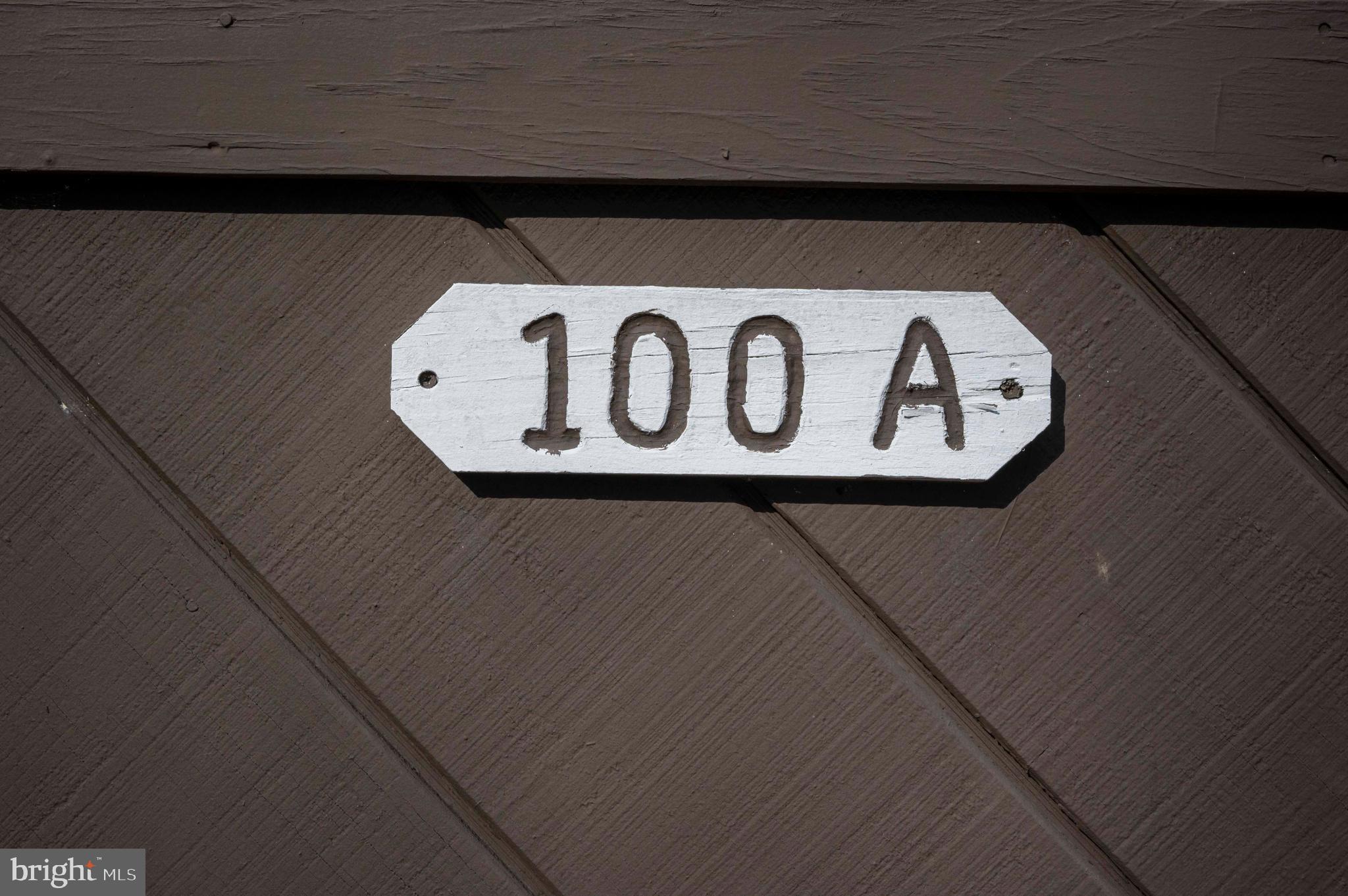 377 Spitz Lane, Unit 100 Basye, VA 22810 - Photo 2 of 69 a close up of a sign on a wall