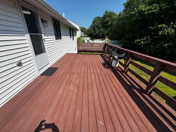a view of a chairs and table in patio