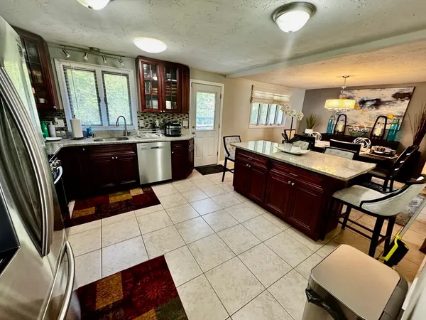 a kitchen with a sink and appliances
