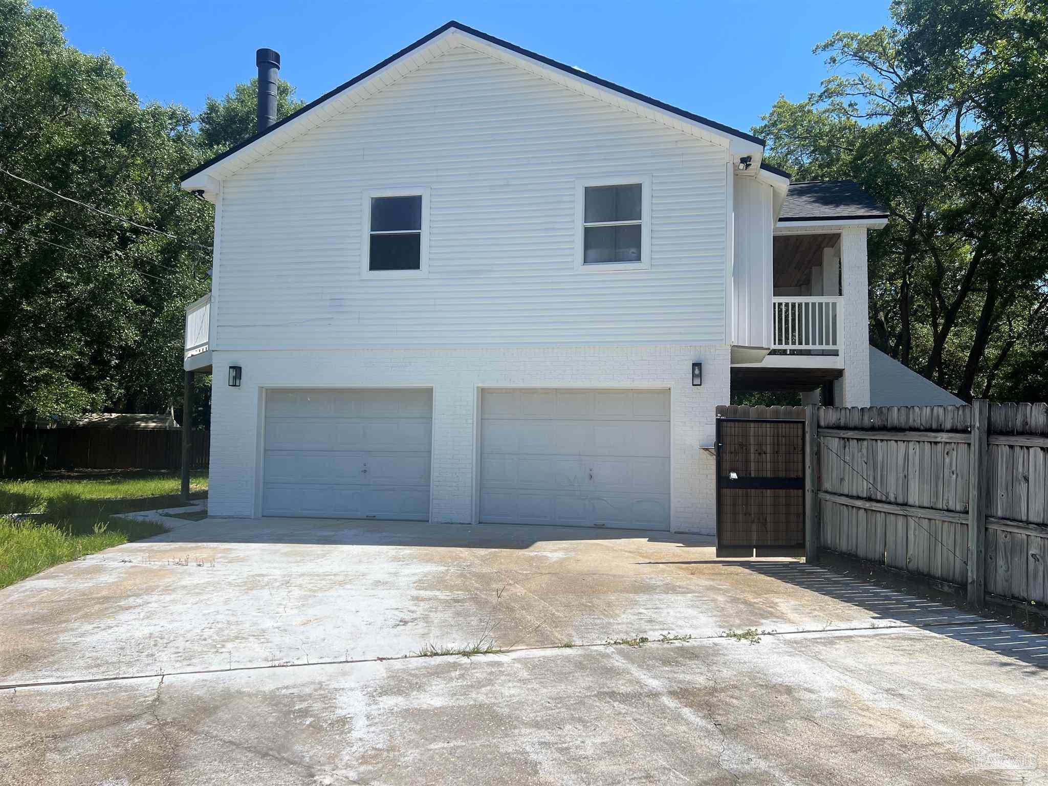 3111 Holley Point Road Navarre, FL 32566 - Photo 19 of 23 a front view of a house with a yard