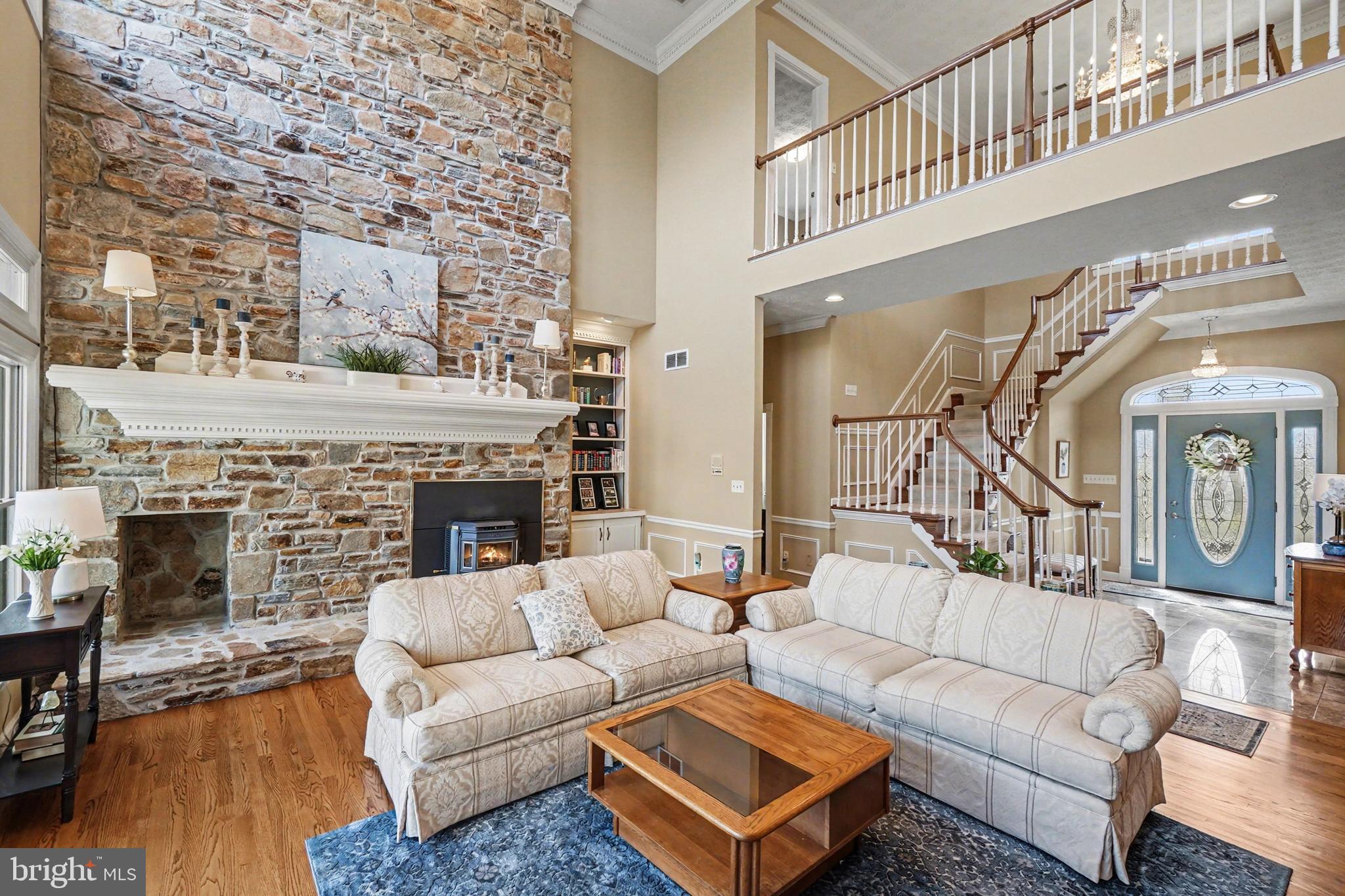 2309 Kings Arms Drive Fallston, MD 21047 - Photo 12 of 89 a living room with furniture a fireplace and a wooden floor