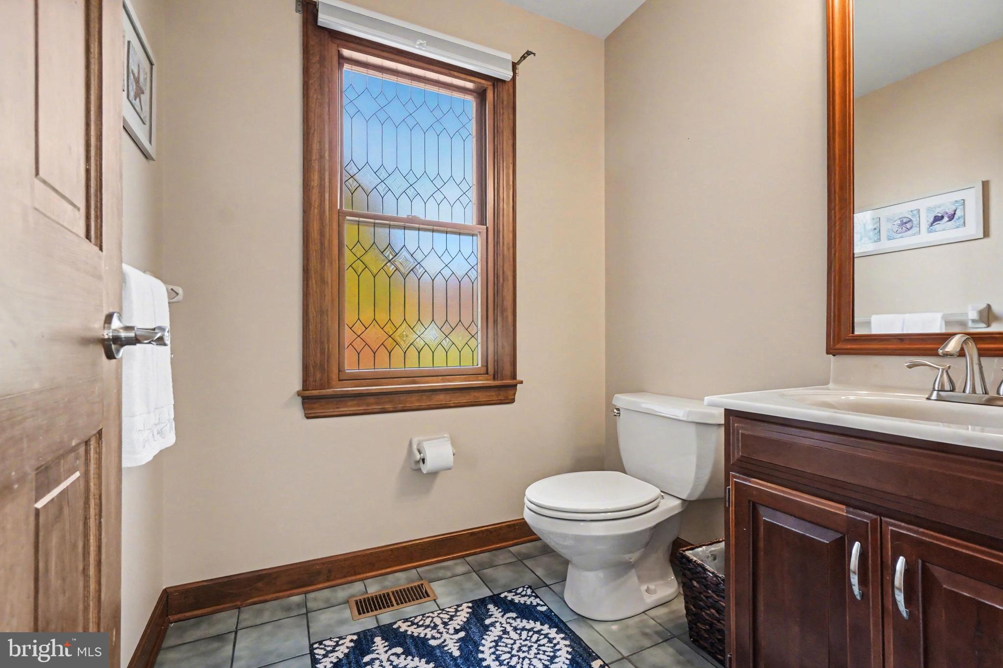 2309 Kings Arms Drive Fallston, MD 21047 - Photo 22 of 89 a bathroom with a toilet a sink and a window