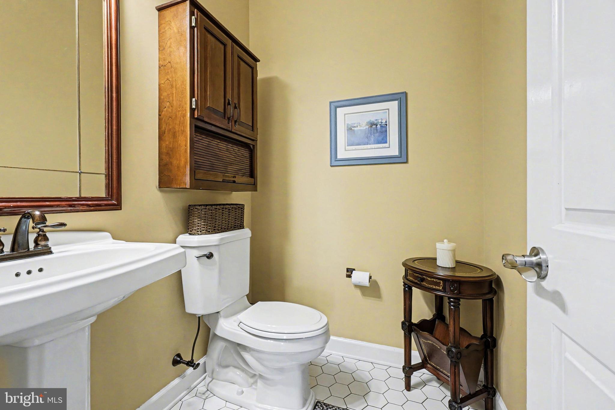 2309 Kings Arms Drive Fallston, MD 21047 - Photo 31 of 89 a bathroom with a sink a toilet and a mirror