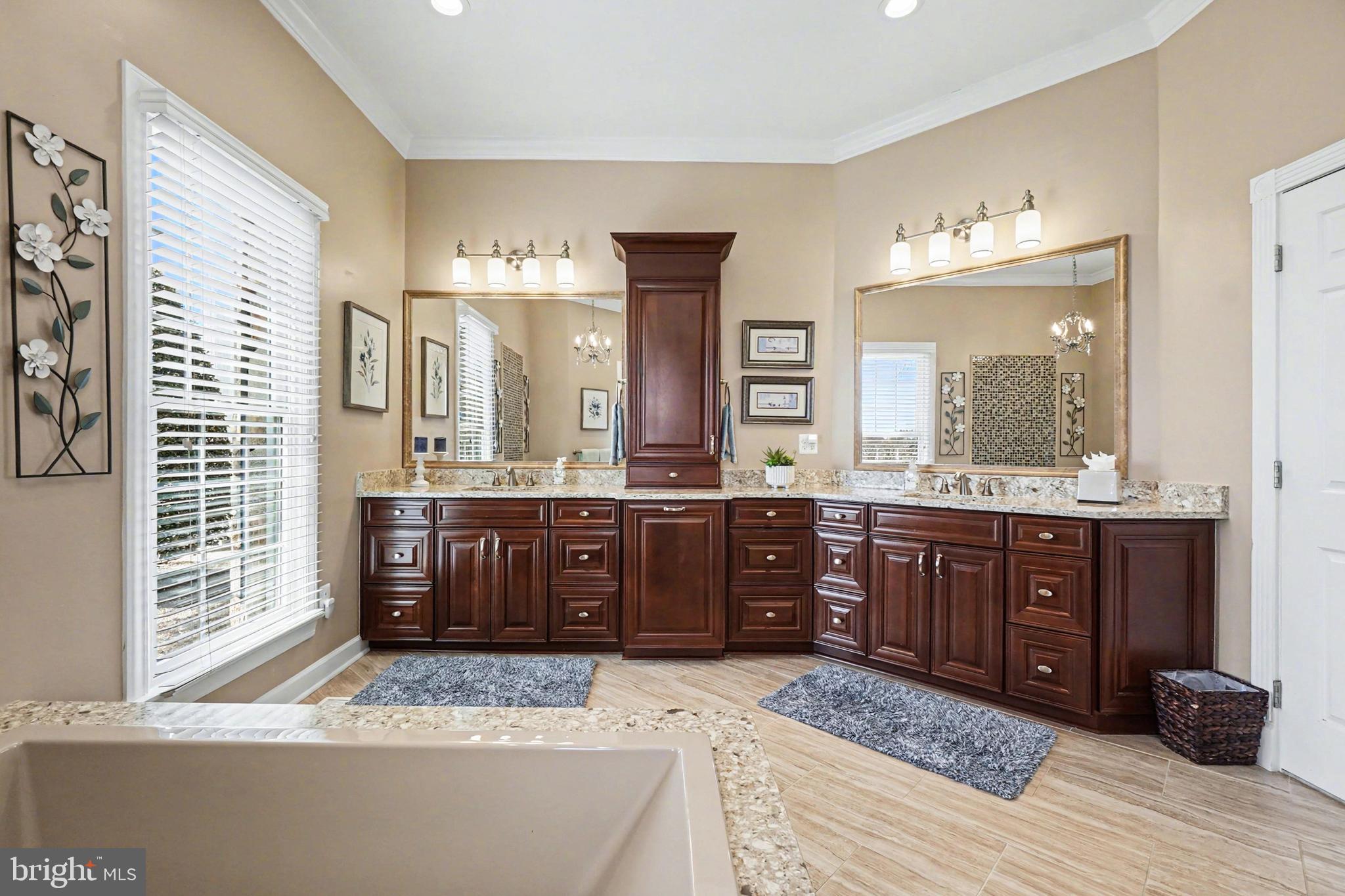 2309 Kings Arms Drive Fallston, MD 21047 - Photo 43 of 89 a bathroom with a granite countertop tub a double vanity sink and a large mirror