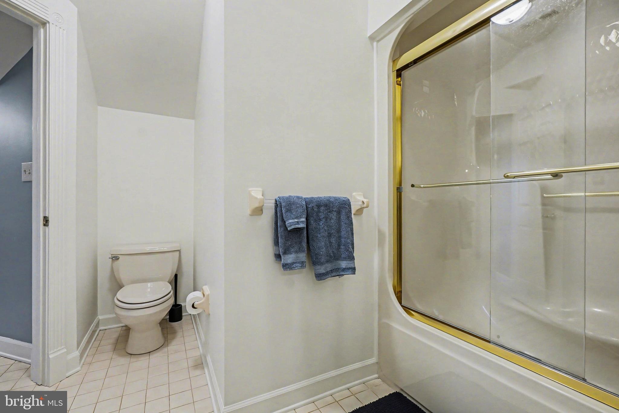 2309 Kings Arms Drive Fallston, MD 21047 - Photo 59 of 89 a bathroom with a granite countertop toilet and a shower