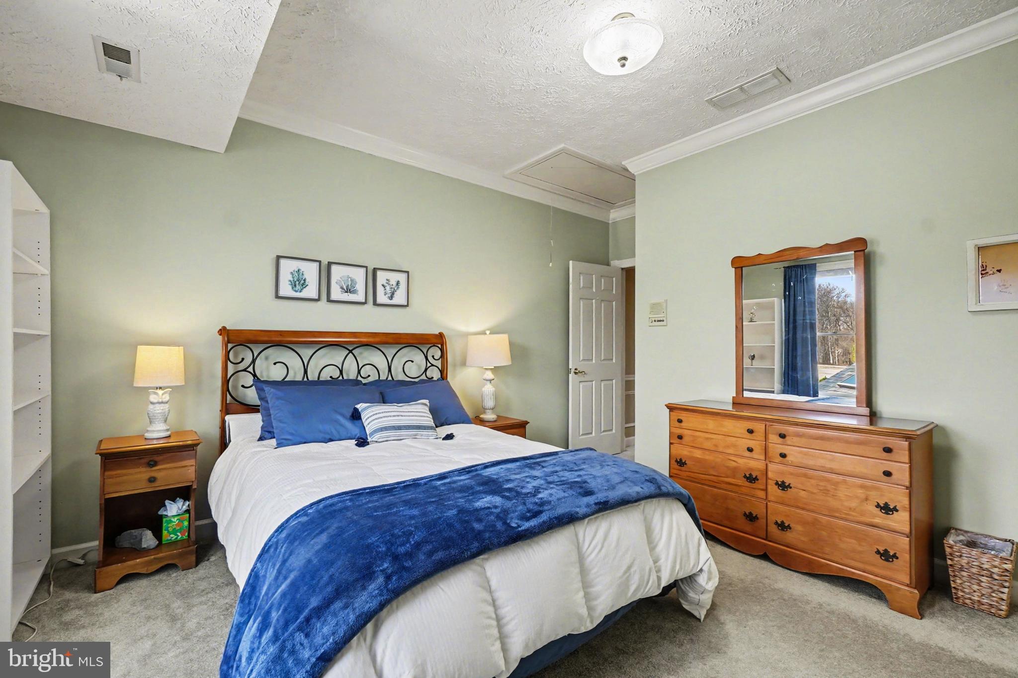 2309 Kings Arms Drive Fallston, MD 21047 - Photo 61 of 89 a bedroom with a bed and a dresser