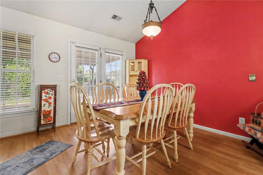 304 Allegheny Avenue Dallas, GA 30132 - Photo 13 of 30 a view of a dining room with furniture and chandelier
