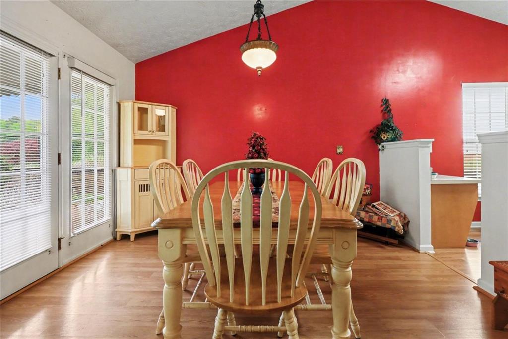 304 Allegheny Avenue Dallas, GA 30132 - Photo 14 of 30 a view of a dining room with furniture and wooden floor