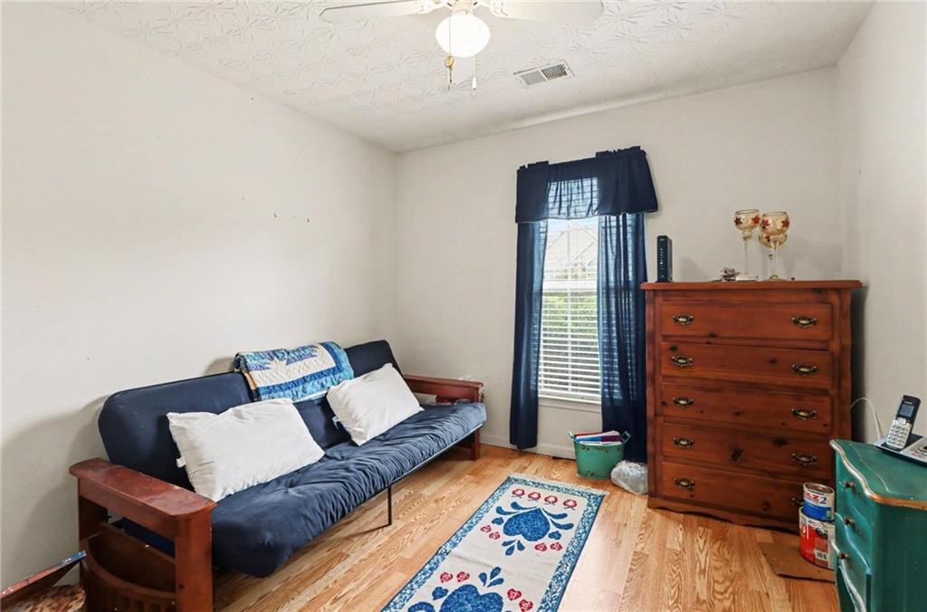 304 Allegheny Avenue Dallas, GA 30132 - Photo 15 of 30 a living room with furniture and a lamp