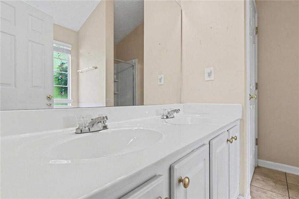 304 Allegheny Avenue Dallas, GA 30132 - Photo 21 of 30 a bathroom with a sink and a mirror