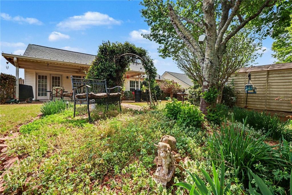 304 Allegheny Avenue Dallas, GA 30132 - Photo 26 of 30 a view of a house with backyard sitting area and garden