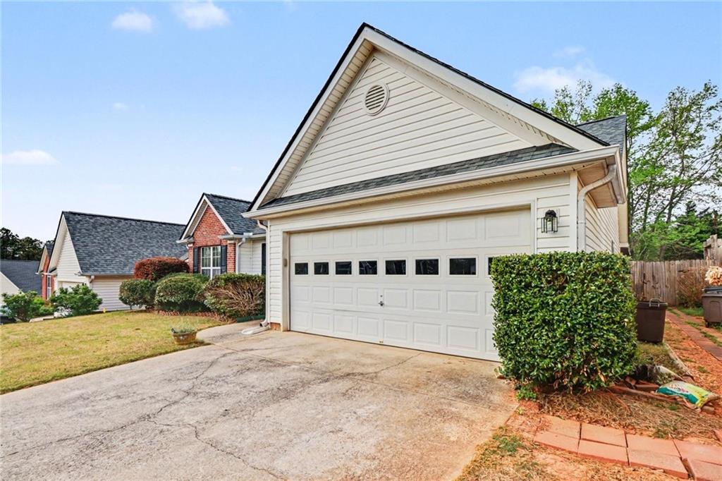 304 Allegheny Avenue Dallas, GA 30132 - Photo 3 of 30 a front view of a house with a yard and garage