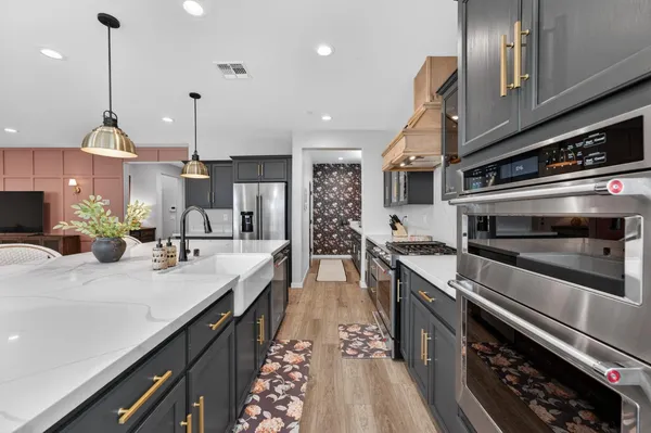 a kitchen with sink and stove