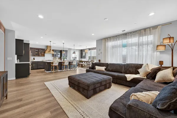 a living room with furniture and a rug