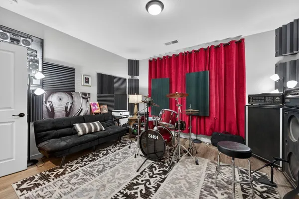 a view of a workspace with furniture and a window