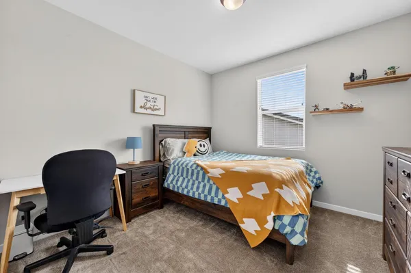 a bedroom with a bed and a cabinets