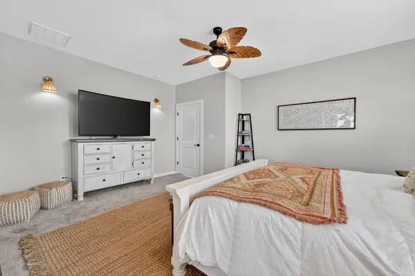 a spacious bathroom with a double vanity sink a mirror a bathtub and shower