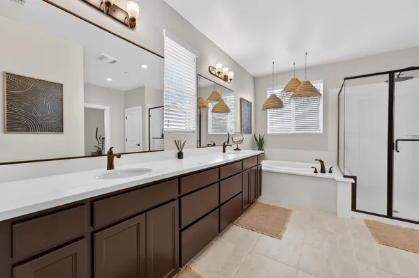 a bathroom with a sink a mirror and a shower