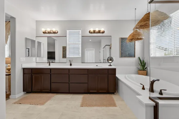 a view of a backyard with table and chairs with wooden floor and fence