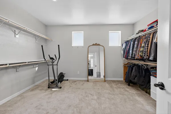 a view of a backyard with table and chairs and wooden fence