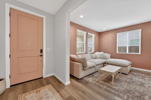a view of livingroom with hardwood floor and hallway