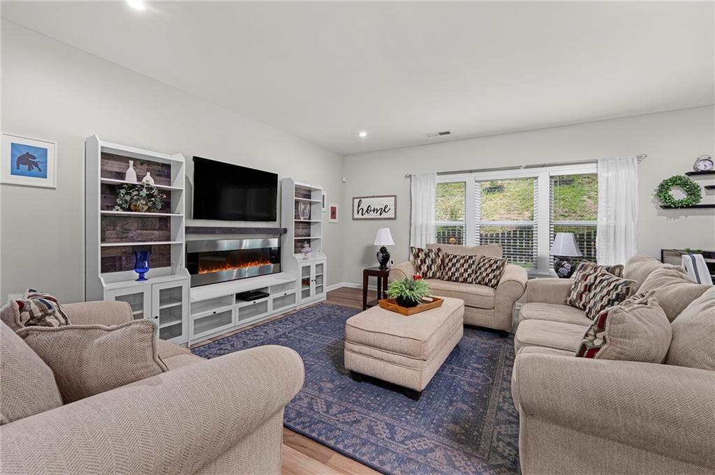 230 Augusta Walk Canton, GA 30114 - Photo 2 of 56 a living room with furniture and a flat screen tv