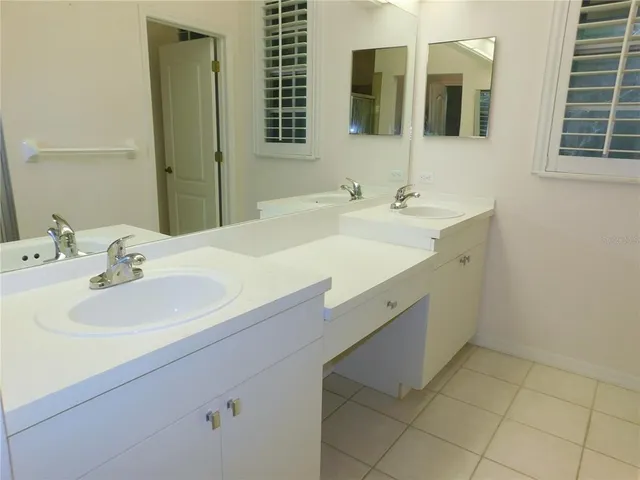 a bathroom with a tub sink and shower