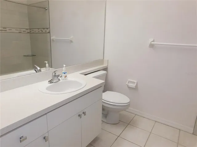 a bathroom with a bath tub and shower