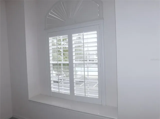 an empty room with closet area