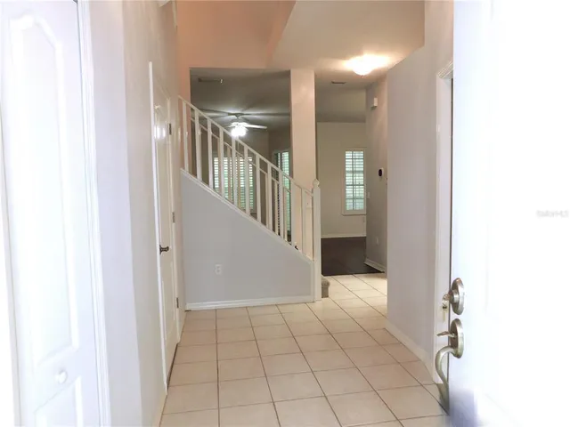 a view of an entryway with wooden floor